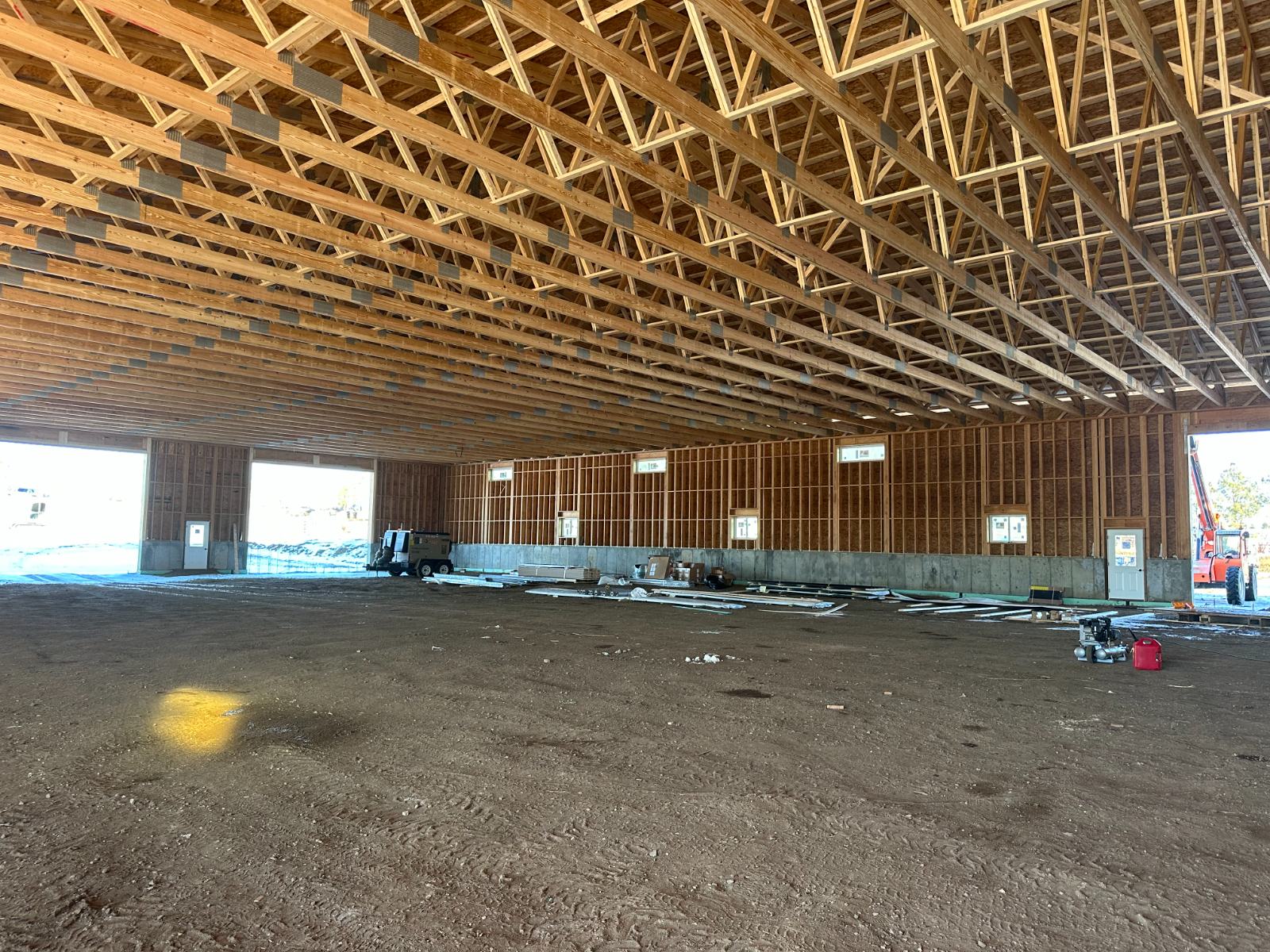Post-frame trusses and spacing on a Prairie Barns build in western North Dakota, before the slab is poured.